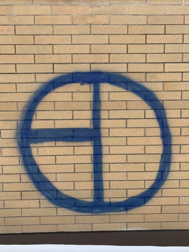 before removing the graffiti